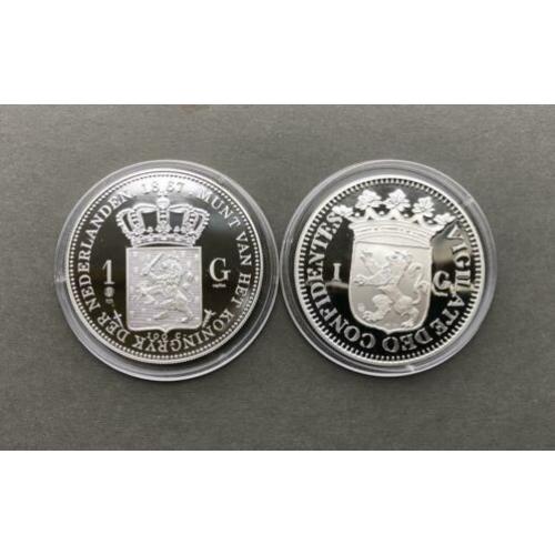 2 proof zilveren munten van 1 gulden 1680 en 1867, replica